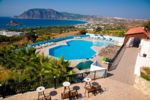 a view of the pool and the ocean from a resort at Pantheon Hotel in Kefalos