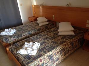 Postel nebo postele na pokoji v ubytování Pantheon Hotel