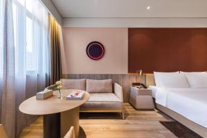 Shanghai Hongqiao Hub Minbei Road Orange Crystal Hotel的休息区