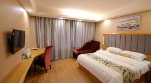 Ένα ή περισσότερα κρεβάτια σε δωμάτιο στο GreenTree Inn Taizhou Gaogang District Business Hotel