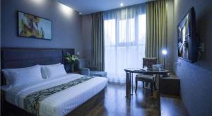 Ένα ή περισσότερα κρεβάτια σε δωμάτιο στο GreenTree Inn Taizhou Gaogang District Business Hotel