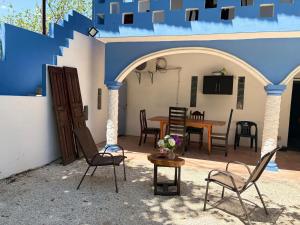 a patio with chairs and a table in a house at Casa Constanza in Valladolid