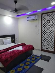 Postel nebo postele na pokoji v ubytování Hotel MJ Palace
