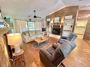 a living room with two couches and a fireplace at Our Anchor-Beach access, 3 BR, pet friendly in St. George Island
