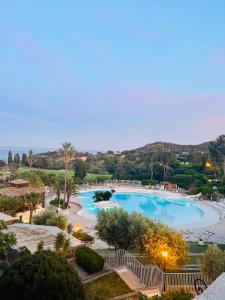 a view of a swimming pool at a resort at Cap Esterel - Duplex avec 2 terrasses dont une tropezienne, piscines et loisirs in Saint-Raphaël