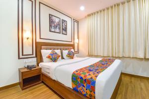 Ένα ή περισσότερα κρεβάτια σε δωμάτιο στο FabHotel LFC