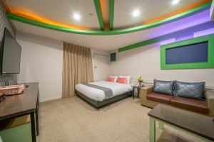 Katil atau katil-katil dalam bilik di Goyohan Hotel
