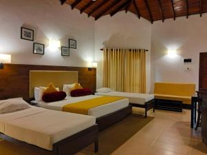 Postel nebo postele na pokoji v ubytování Hotel Kamrel Sigiriya