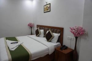 Postel nebo postele na pokoji v ubytování Hotel Frolic Stay