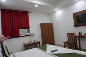 TV a/nebo společenská místnost v ubytování Hotel Frolic Stay