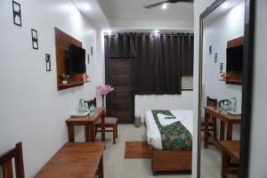 Postel nebo postele na pokoji v ubytování Hotel Frolic Stay