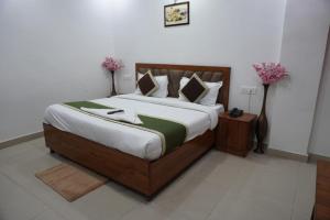 Postel nebo postele na pokoji v ubytování Hotel Frolic Stay