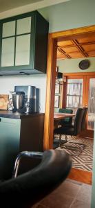 a kitchen and dining room with a table and chairs at Ferienhaus Villa Zauberblick am Rennsteig Frankenwald in Ludwigsstadt +69 photos