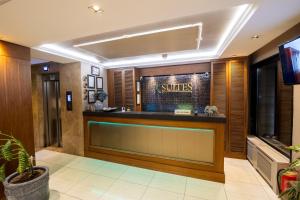a hotel lobby with a reception desk and a tv at Şişli Luxury K Suites Hotel in Istanbul +35 photos