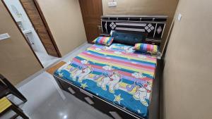 Giường trong phòng chung tại Deva Guest House