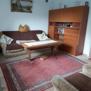 a living room with a couch and a coffee table at Eifelhaus in Niederdorla