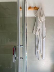 a towel is hanging on a towel rack in a bathroom at La Casetta - Home Gallery in San Fiorano +22 photos