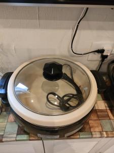 a toilet seat with a cord on top of it at LILY's House in Sano +33 photos