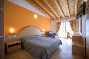 Postel nebo postele na pokoji v ubytování All Inclusive Hotel Piccolo Paradiso