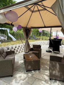 a tent with couches and a table and a piano at MIDA 2 Apartment in Tuheljske Toplice