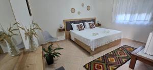 Ένα ή περισσότερα κρεβάτια σε δωμάτιο στο Guesthouse Meçani