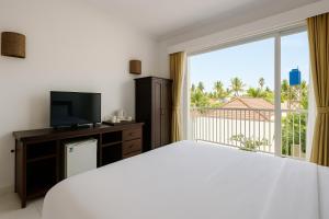 TV a/nebo společenská místnost v ubytování Lumiere Hotel Gili Trawangan