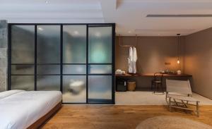 Giường trong phòng chung tại Shanyu Life Huangshan Design Hotel