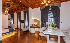 a living room with a couch and a table at Elmira Pera Hotel & - Special Class in Istanbul