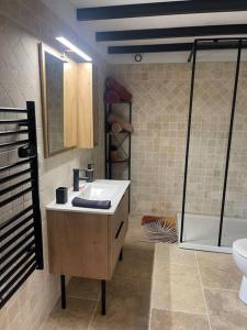 a bathroom with a sink and a toilet and a shower at Au coeur du Gard in Saint-Bauzély +20 photos