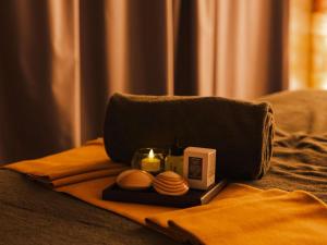 a breakfast tray with a toaster and hamburgers and a candle at 25hours Hotel Dubai One Central in Dubai