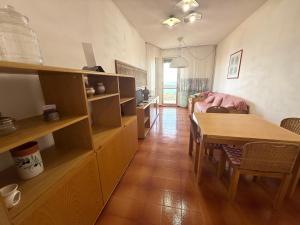 a living room with a table and a dining room at Suite Panorama - Sanremo in Sanremo