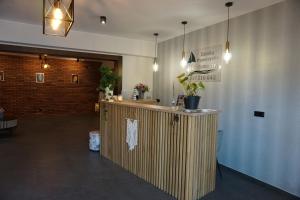 a lobby with a counter in a room at Zatoka Wypoczynku Apartamenty in Władysławowo