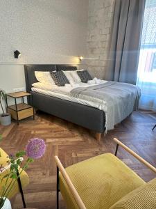 Postel nebo postele na pokoji v ubytování Vanalinna Boutique Hotel