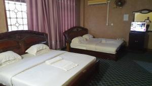 Postel nebo postele na pokoji v ubytování New JBK Hotel