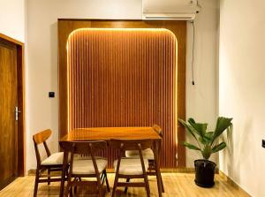 a dining room with a wooden table and chairs at Villa Nuansa Indah 2BR UNGASAN in Uluwatu