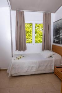 A bed or beds in a room at Dalt Vila Salou