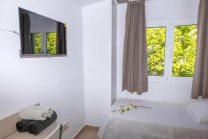 A bed or beds in a room at Dalt Vila Salou