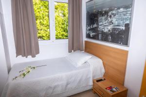 A bed or beds in a room at Dalt Vila Salou