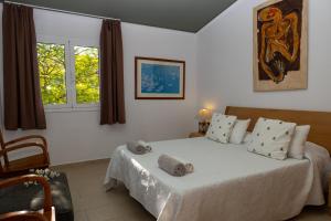 A bed or beds in a room at Dalt Vila Salou