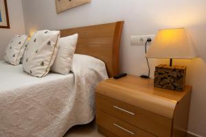 A bed or beds in a room at Dalt Vila Salou