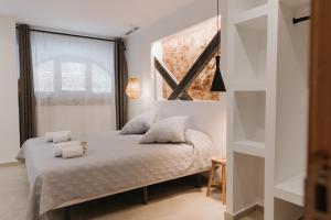 Postel nebo postele na pokoji v ubytování Hulot B&B Valencia