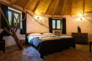 a bedroom with a bed with pillows on it at ECO Beach Houses - Pet friendly in Peroj