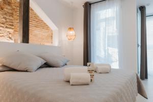 Postel nebo postele na pokoji v ubytování Hulot B&B Valencia