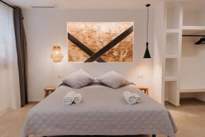 Postel nebo postele na pokoji v ubytování Hulot B&B Valencia