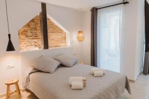 Postel nebo postele na pokoji v ubytování Hulot B&B Valencia