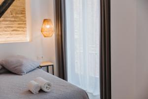 Postel nebo postele na pokoji v ubytování Hulot B&B Valencia