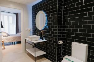 Postel nebo postele na pokoji v ubytování Hulot B&B Valencia