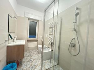 a bathroom with a shower and a toilet and a sink at Dimora in Costiera Amalfitana in Maiori