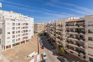 an aerial view of a city with tall buildings at Casa Verde in Armação de Pêra +5 photos