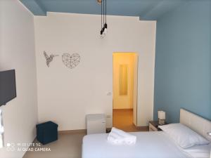 Postel nebo postele na pokoji v ubytování iMama' Rooms